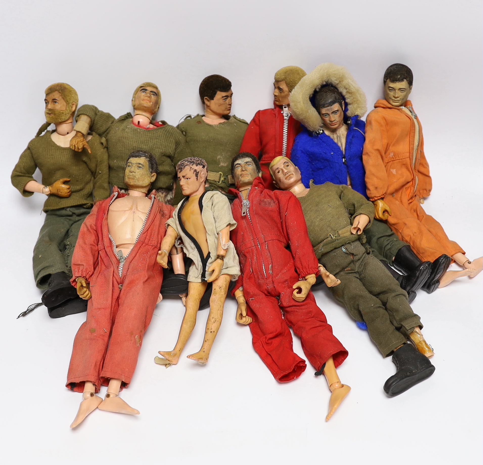 Nine 1960s/70s Action Man figures together with clothes and some accessories (a.f.)